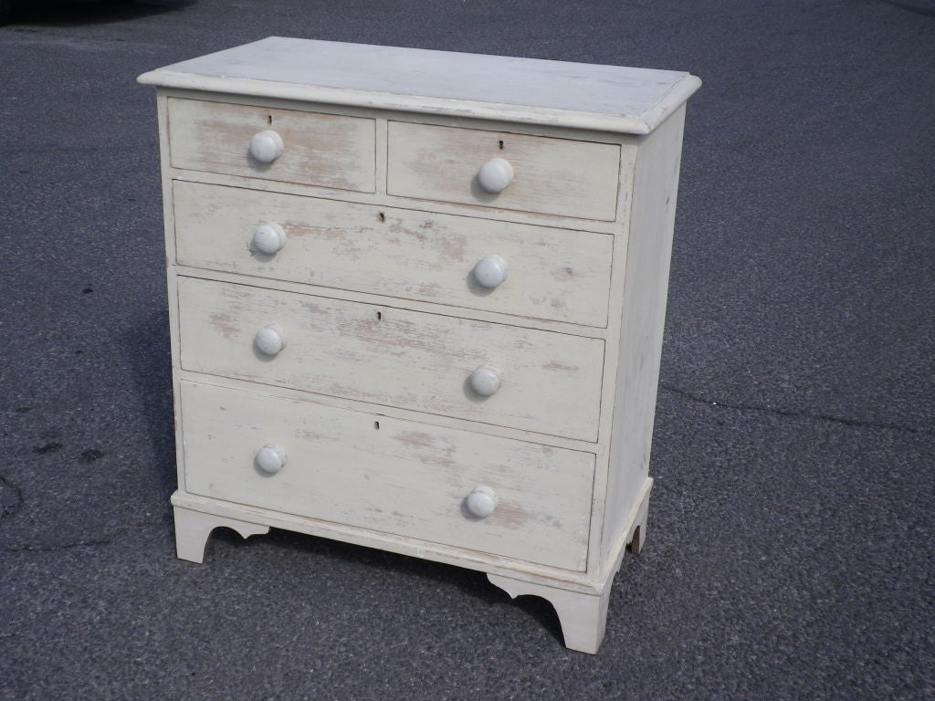 Antique English pine chest of drawers, paint added later.
