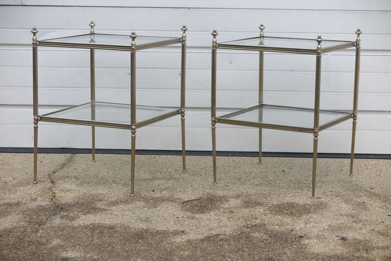 Circa 1930 Chrome and glass French side tables.  Glass on both shelves has mirror surround.Only one available.Priced per item.