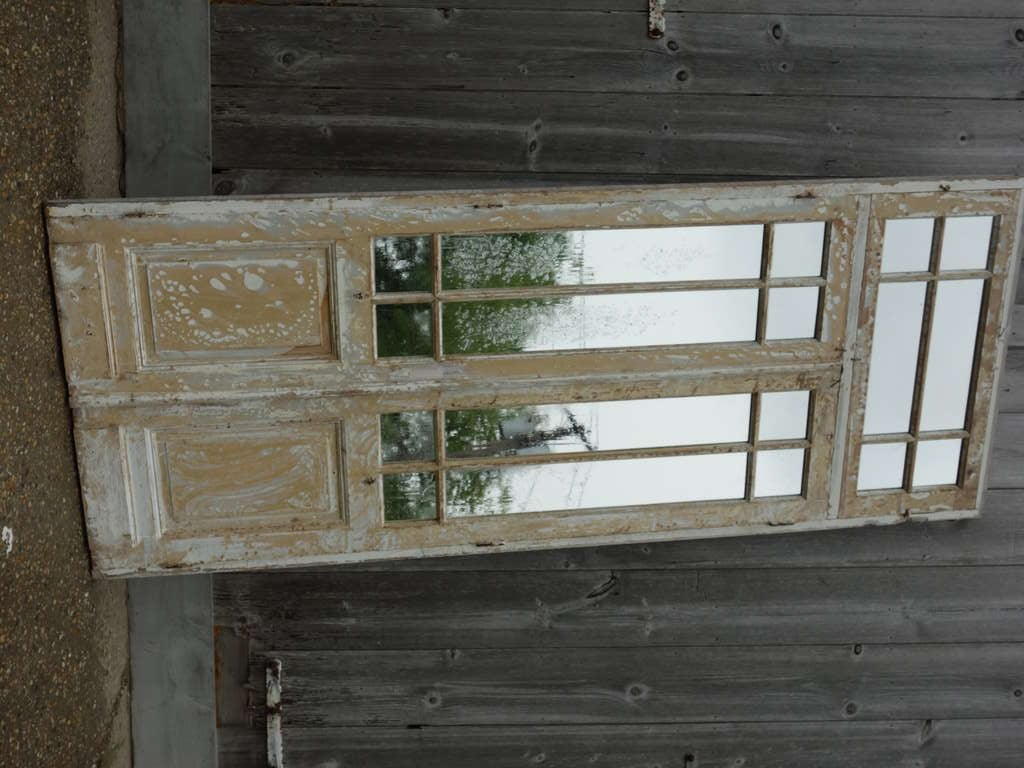 Distressed, painted wood door with mirror