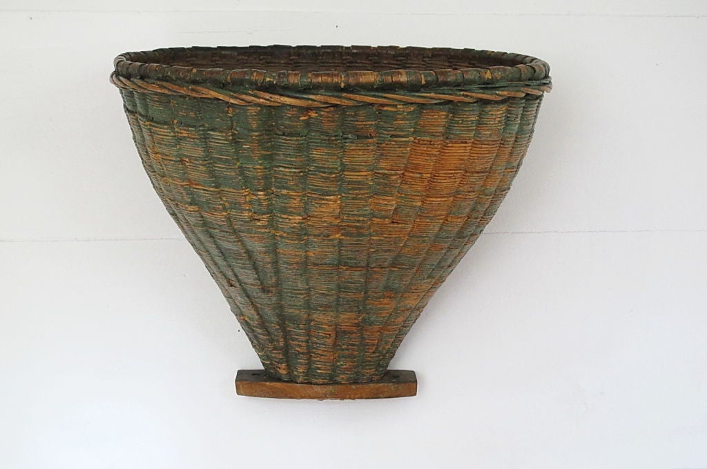 A stunning French vineyard basket with remains of original green paint. These baskets were used for collecting grapes and were carried on the workers back. (straps missing).