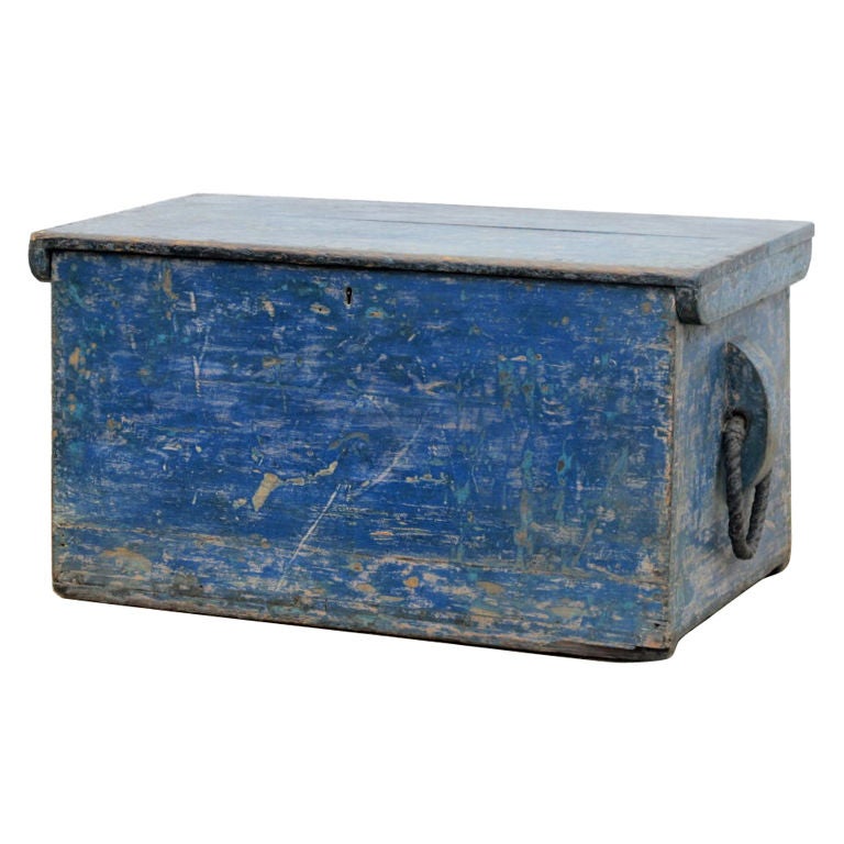 Antique trunk with rope handles and original paint in a lovely patina. Two small drawers with compartments inside.