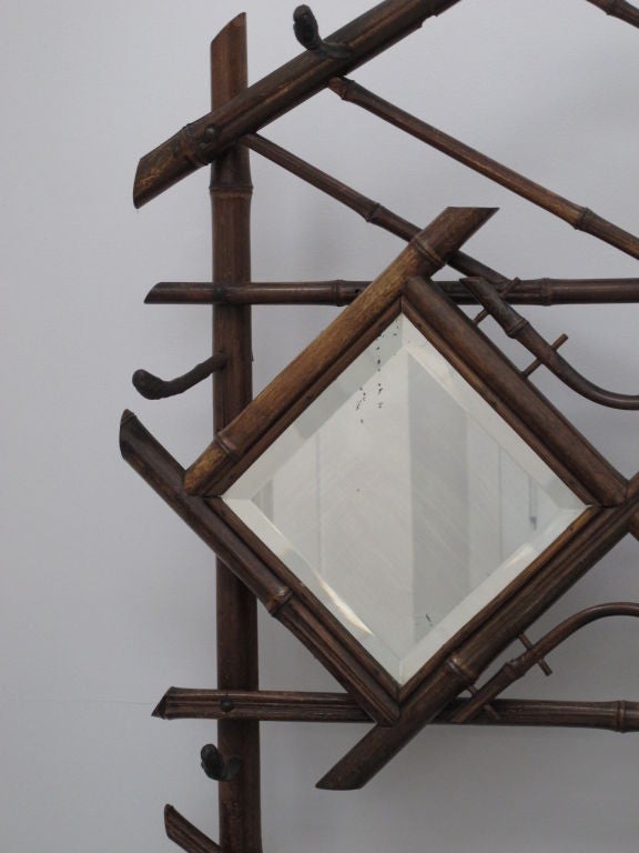 Bamboo coat stand from France with 2 diamond shaped mirrors and rattan detail.