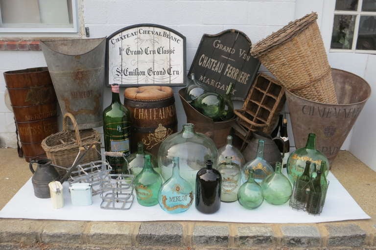 French winemaking objects including bottles, baskets and barrels. Please contact dealer for pricing and measurements. Each item sold separately.