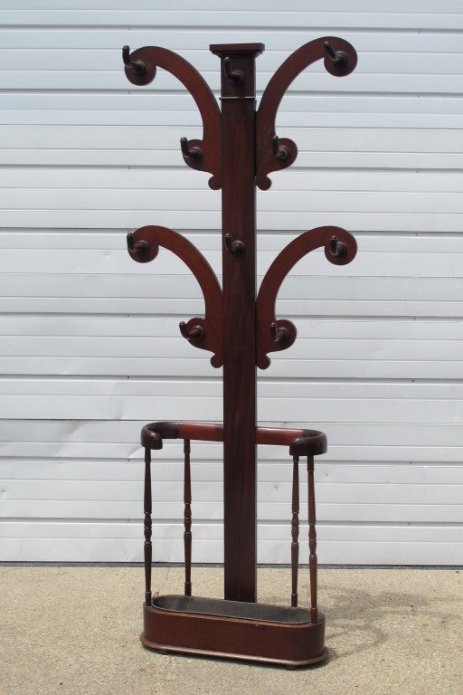 English hall stand with original drip tray and coat hooks.