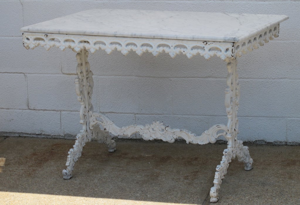 English Cast Iron Table with Carrara marble top, Can be used outside or inside, white painted base, very strong and sturdy.