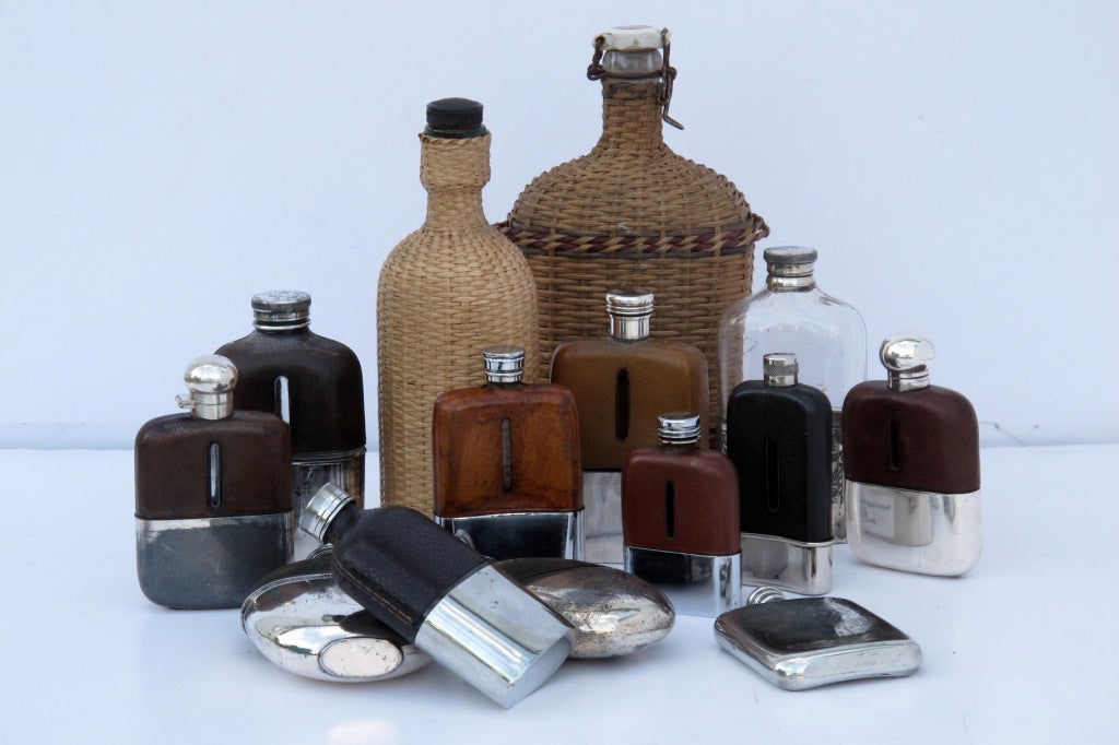 A collection of English c 1900 flasks and picnic bottles with leather covers, some with original silver travle cups. Priced separately, from $ 135 each - $ 285 each