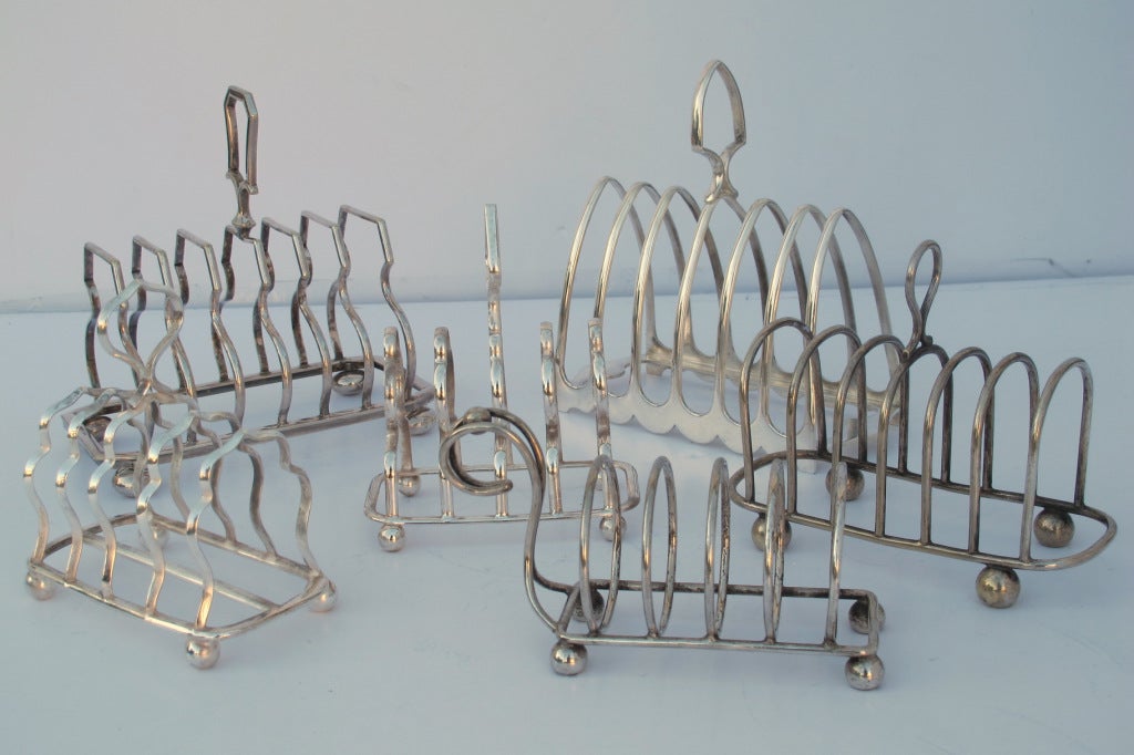 Selection of English silver plated taost racks, c. 1940. Sold separately starting at $125.