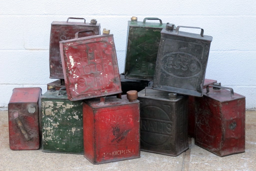 A decorative collection of 12 vintage shell & Esso gas cans with remains of original color. sold as a set $ 1750