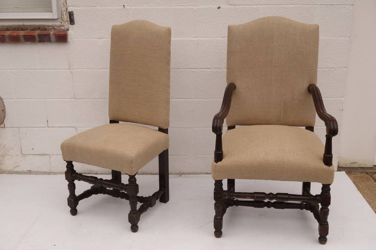 Set of 19th Century French Oak Dining chairs newly upholstered in antique French Linen. (Side chairs: 19.5