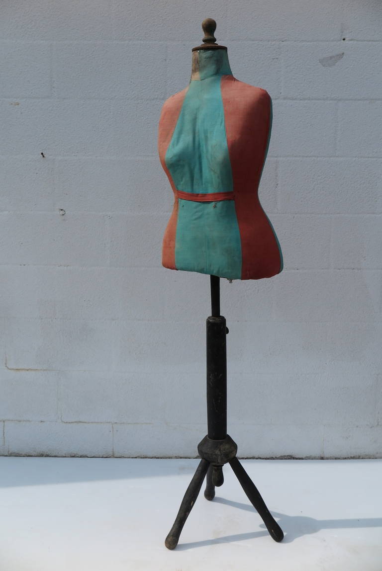 An unusual dressmaker's dummy in original fabric and stand.