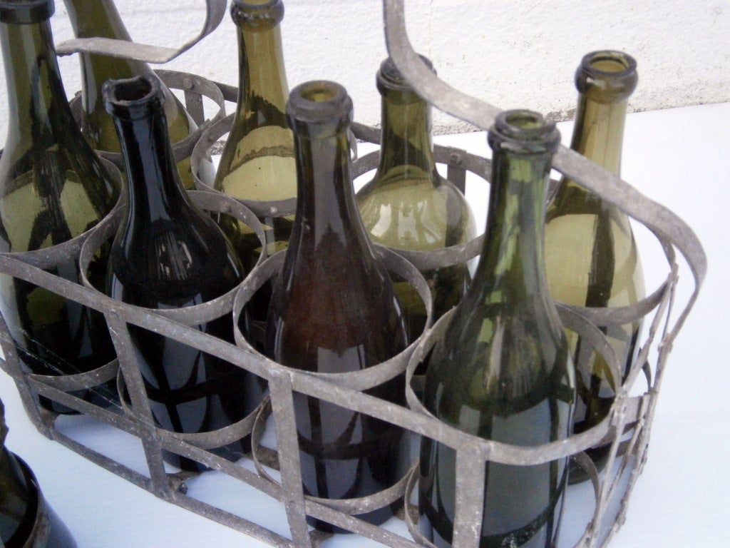 We have a collection of old French metal wine bottle holders, or carriers. Sold individually, from $185 to $250 each.
Bottles sold seperately...
feb 2013. 8 bottle and 6 bottle, bottom left image 4 sold