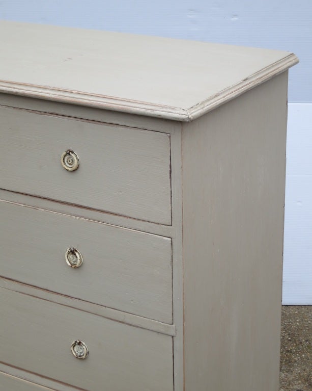 A charmingly simple dresser, with 2 on 3 drawer configuration. old brass hardware. Later Painted.