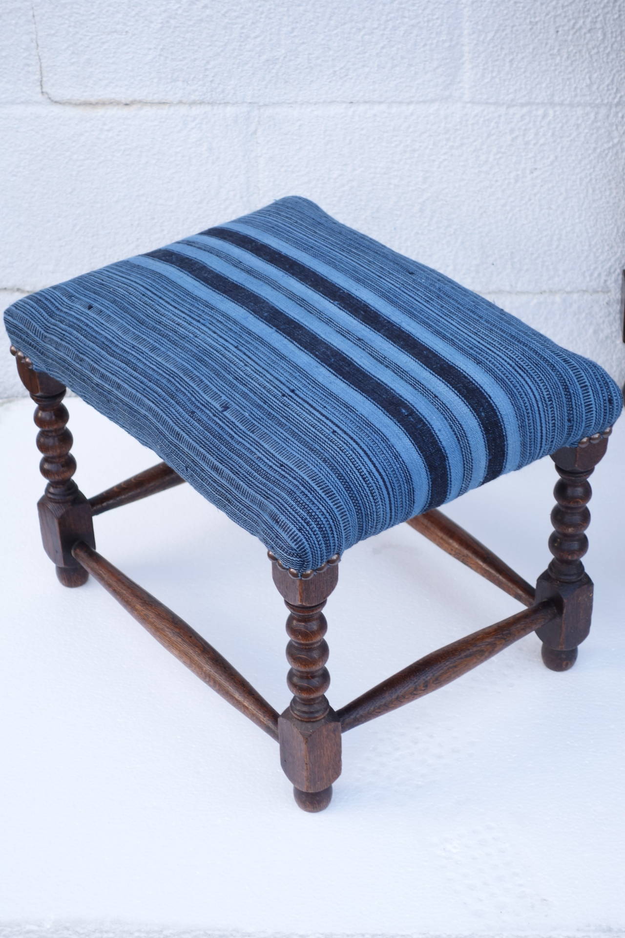 English stools newly reupholstered in antique indigo fabric. Dimensions shown for largest stool. Could also be sold separately, please contact for more information.