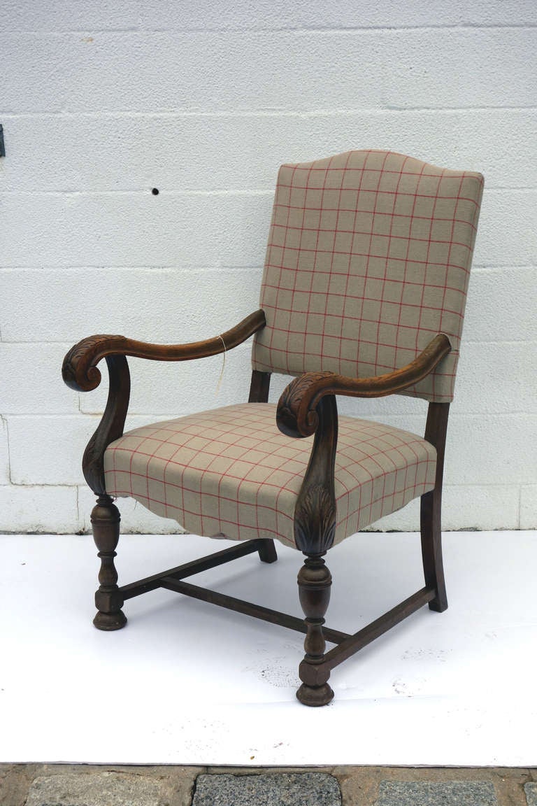 Upholstered armchairs with carved detailing and later fabric. Sold as a pair.