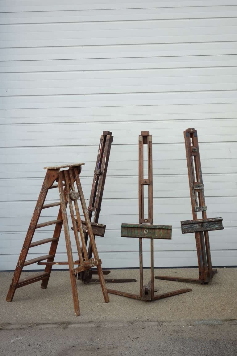 Collection of English Artist easels with remains of paint. One ladder with easel on the back. Three easels have folding out stands. These were used for travel and outdoor painting.