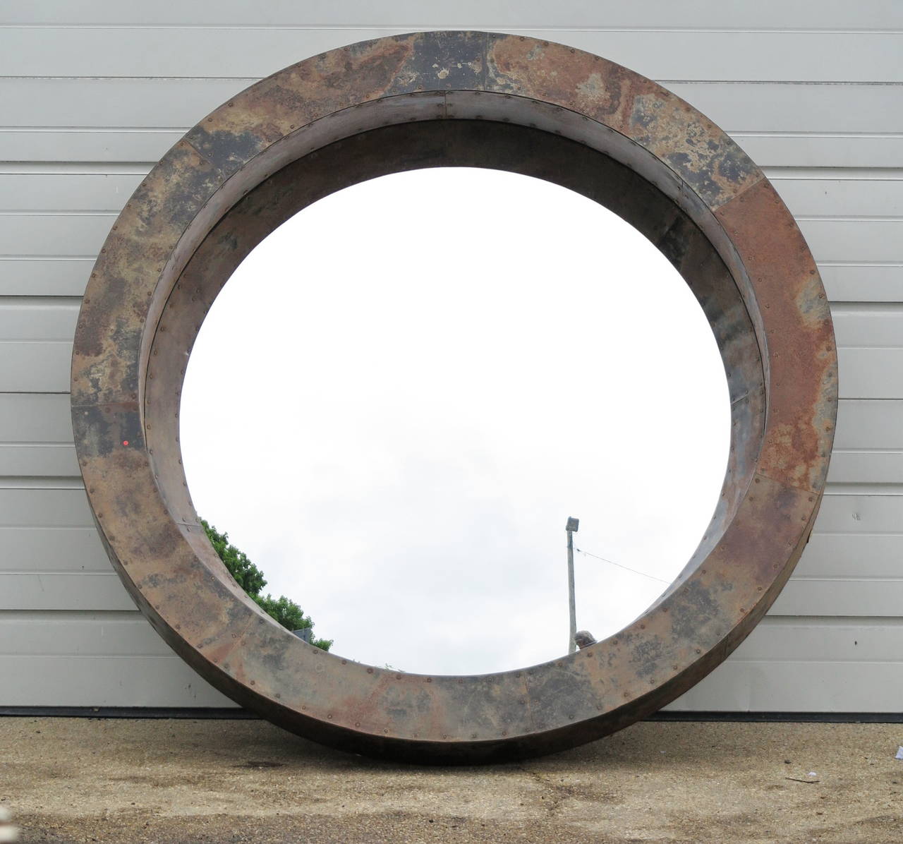 Convex mirror with handmade metal frame with rust finish. Can be ordered in other sizes, made for us in the UK.
This piece, 56