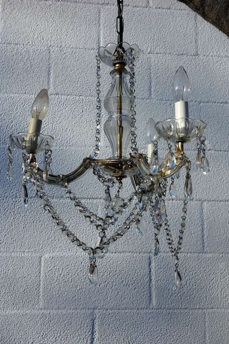 A very pretty small French Crystal chandelier with 3 lights.