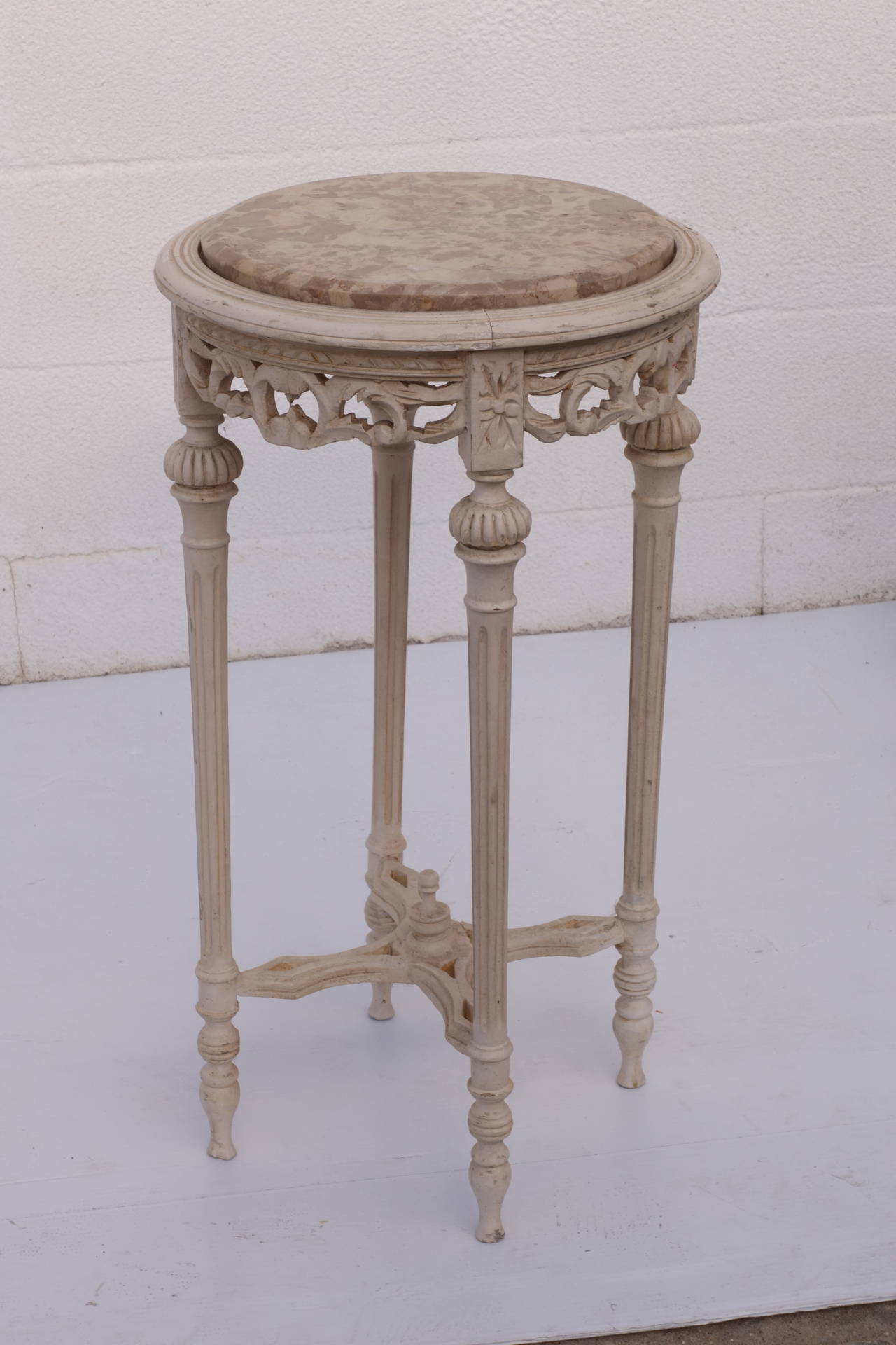 Limed finish on base done at a later date. Marble top on intricately carved table base. Please contact for current availability.