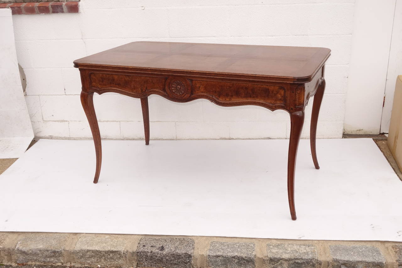 Louis XV styling with exquisite carved detailing. Oak and burr body with central circular floral frieze, raised on delicate cabriole legs. Please contact us for current availability.