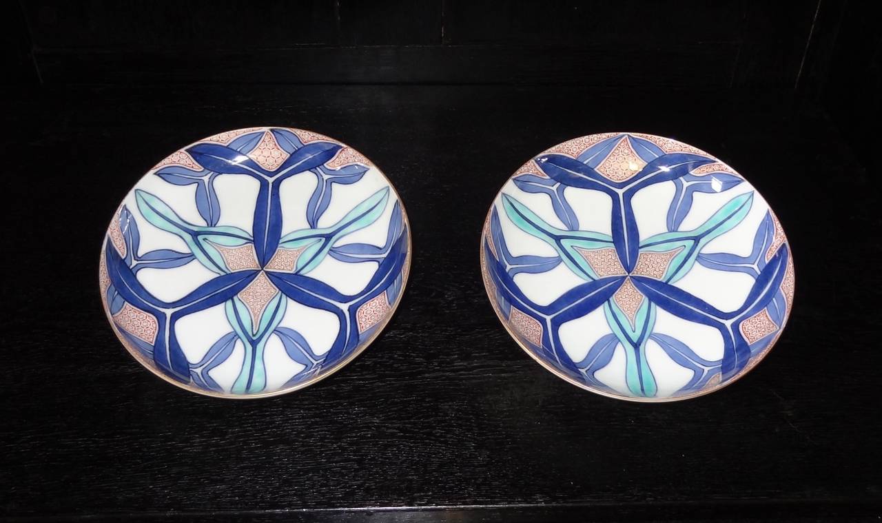 A Pair of early 20th century Japanese Nabeshima footed porcelain dishes with polychrome decoration.