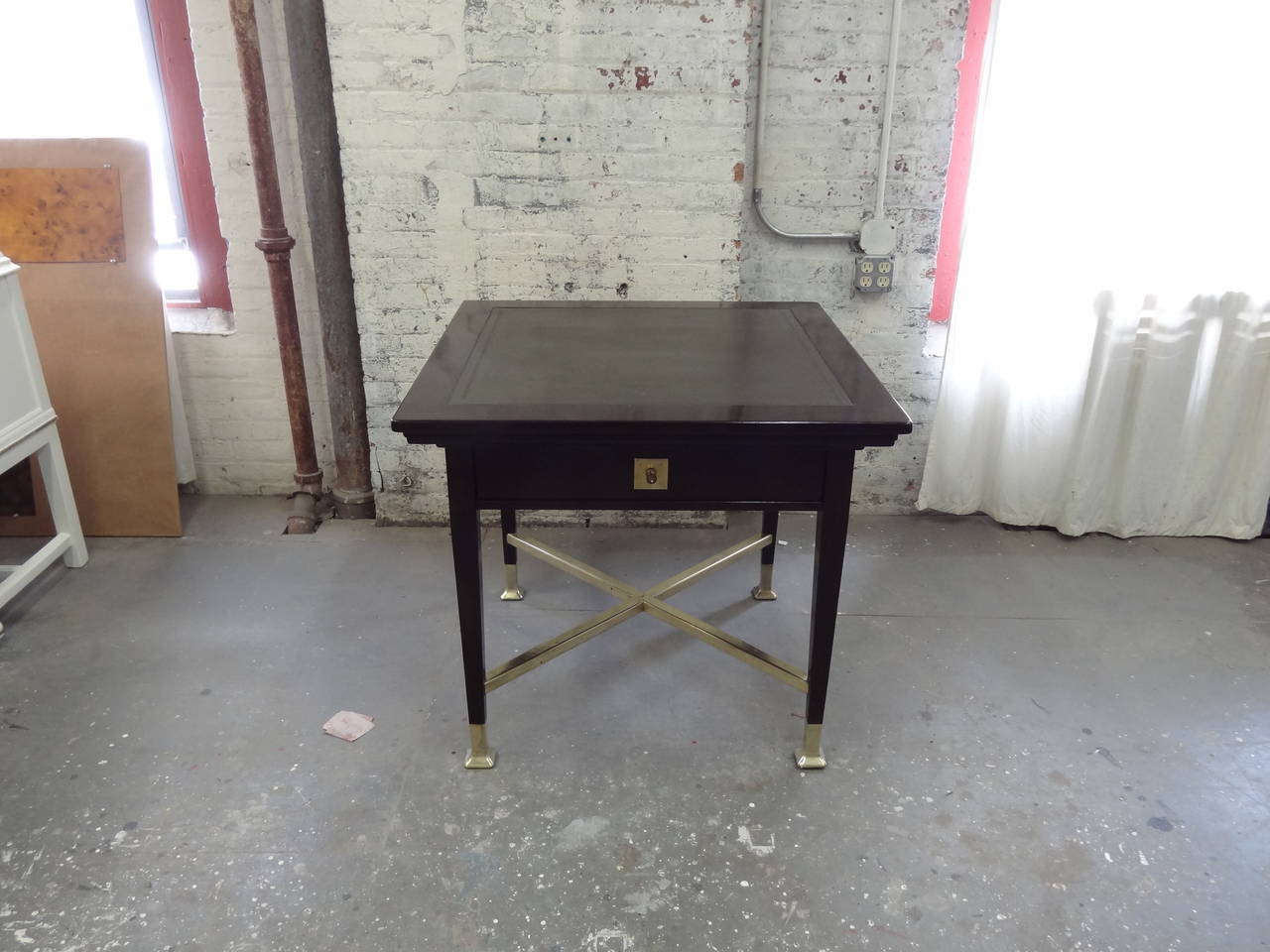 An unusual Austrian Secessionist period card table with four synchronized mechanical corner trays and one push-pull drawer, each tray with brass lined cigar rest, drink recess and flip-out tray, the trays are linked by a hidden wooden gear mechanism