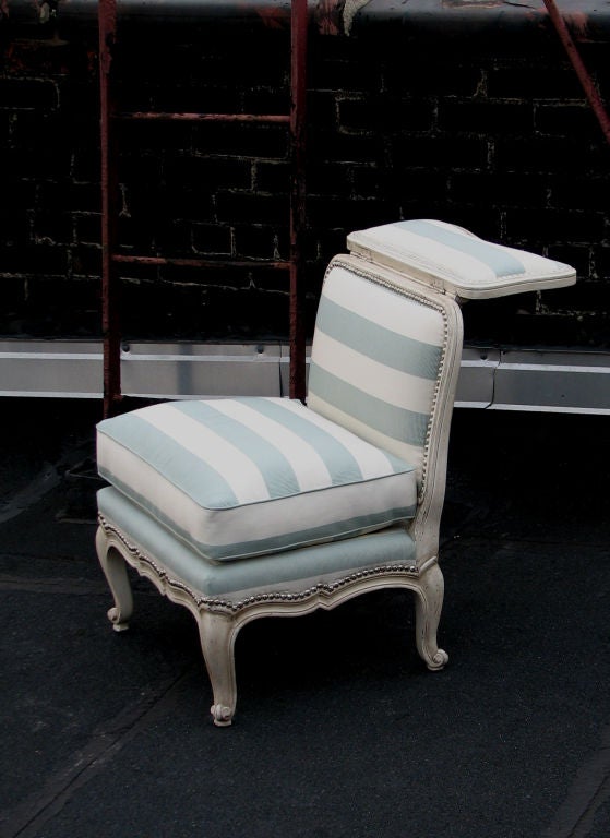 A Louis XV style Voyeuse side chair with a folding hinged back.