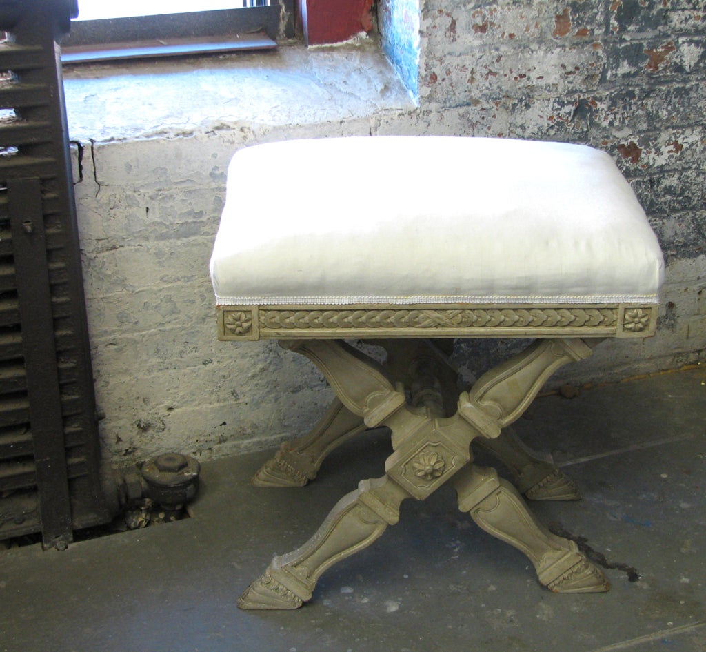 A finely carved and painted Louis XVI style vintage bench with X-form legs and a stretcher, upholstered in muslin. Total of four available.