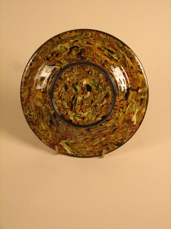A 19th century mixed earth pottery plate from the Pichon factory. Impressed signature. Uzes, France, circa 1860.