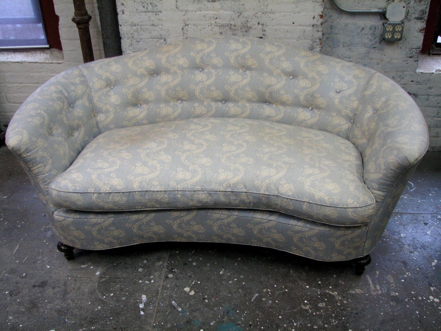 20th Century A Small Victorian Style Camel Back Sofa