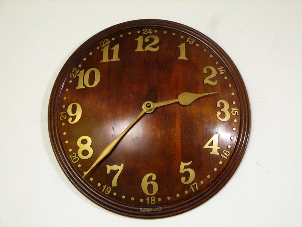 A convex wall clock by Zenith and retailed by Heal's with brass hands and numbering. England, circa 1960. Original 8 day time only, Swiss movement.