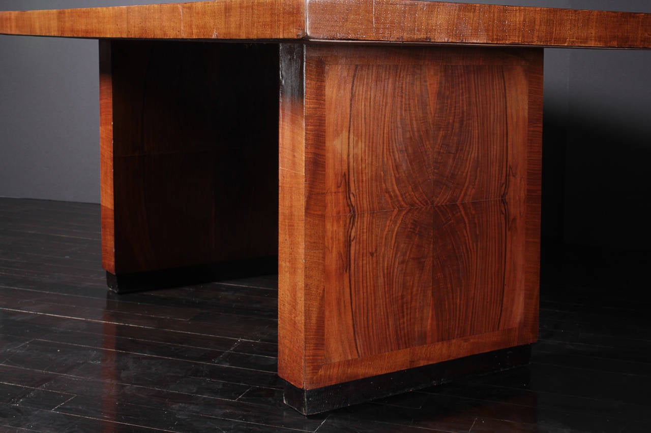 A rich beautiful quarter sawn mahogany desk or dining table with inset black feet.