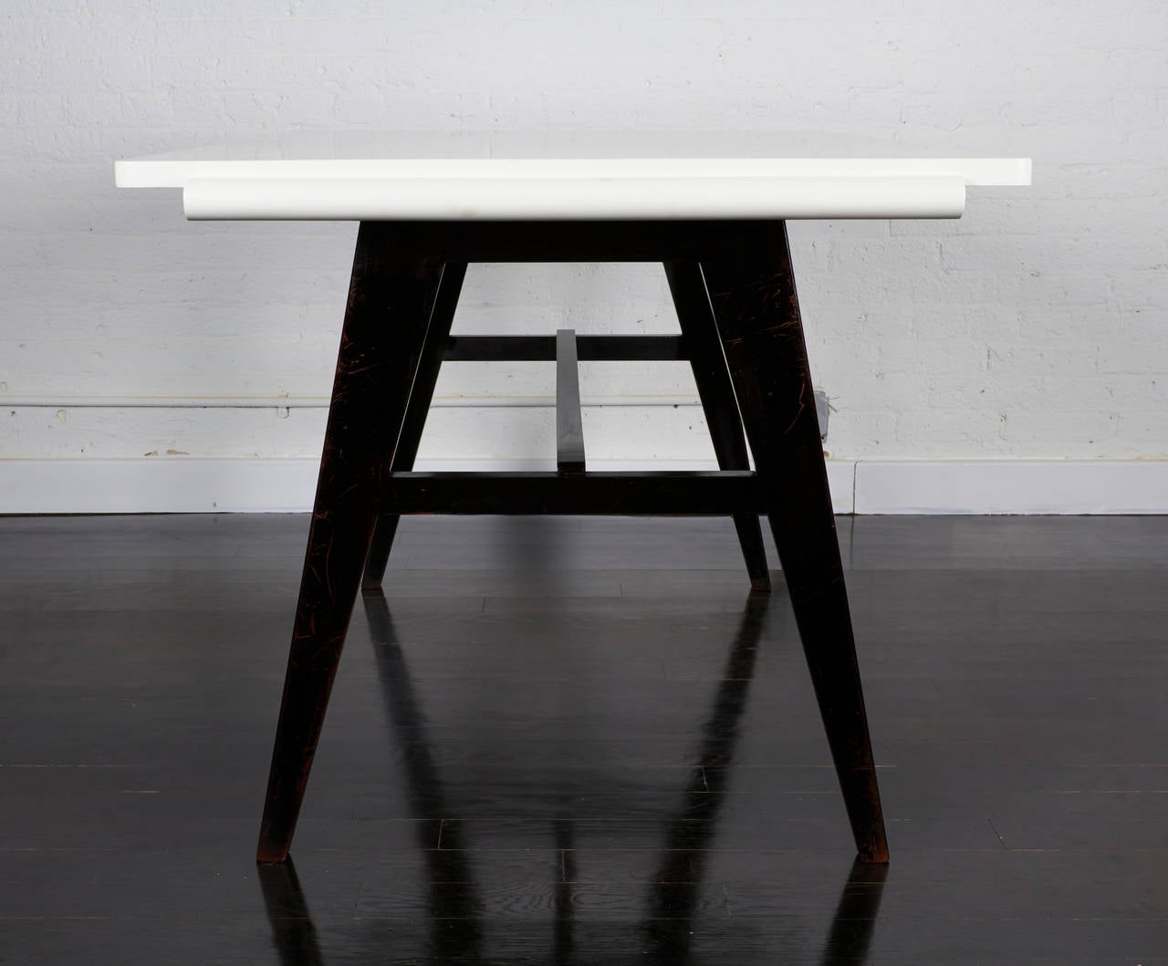 A writing table by British designer Robin Day - 1950, England.
The base is painted black and the top is semi- gloss white lacquer.