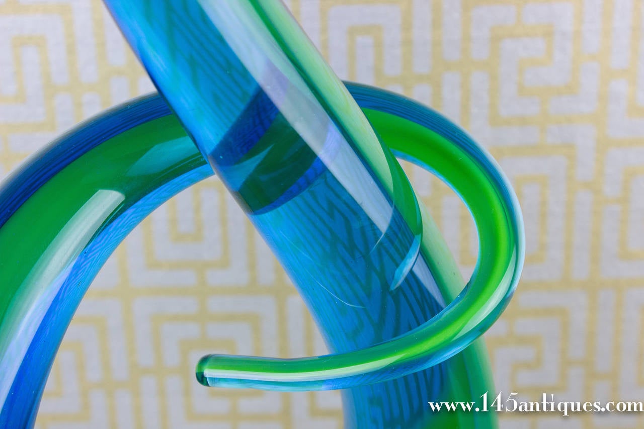 Vintage Murano glass 'Knot' sculpture made of calcedonio glass featuring a multicolor hue of blues and greens with a beautiful rounded base.