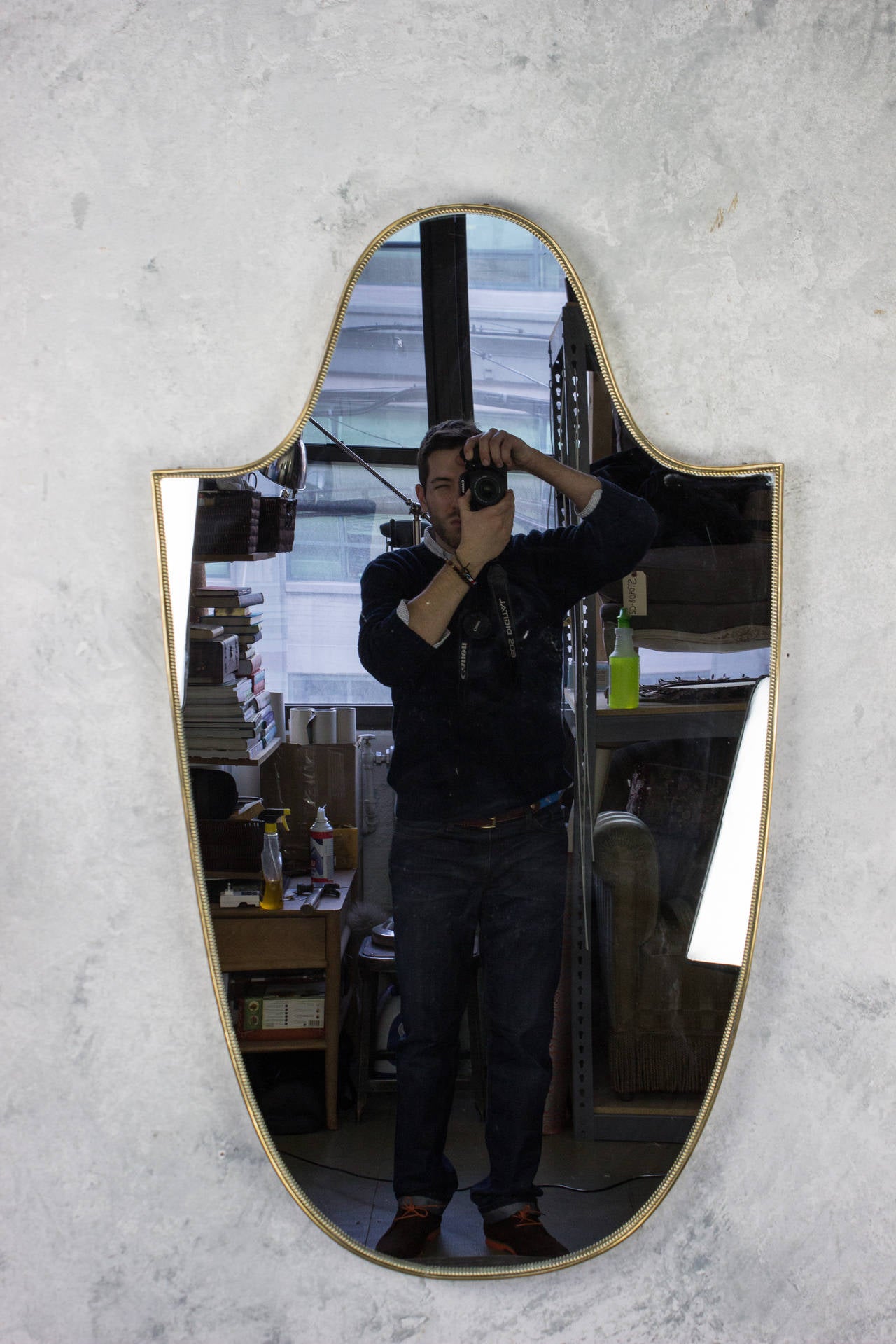 Elongated shield-shaped Italian mirror with inner frame knotting, Italian, circa 1960.