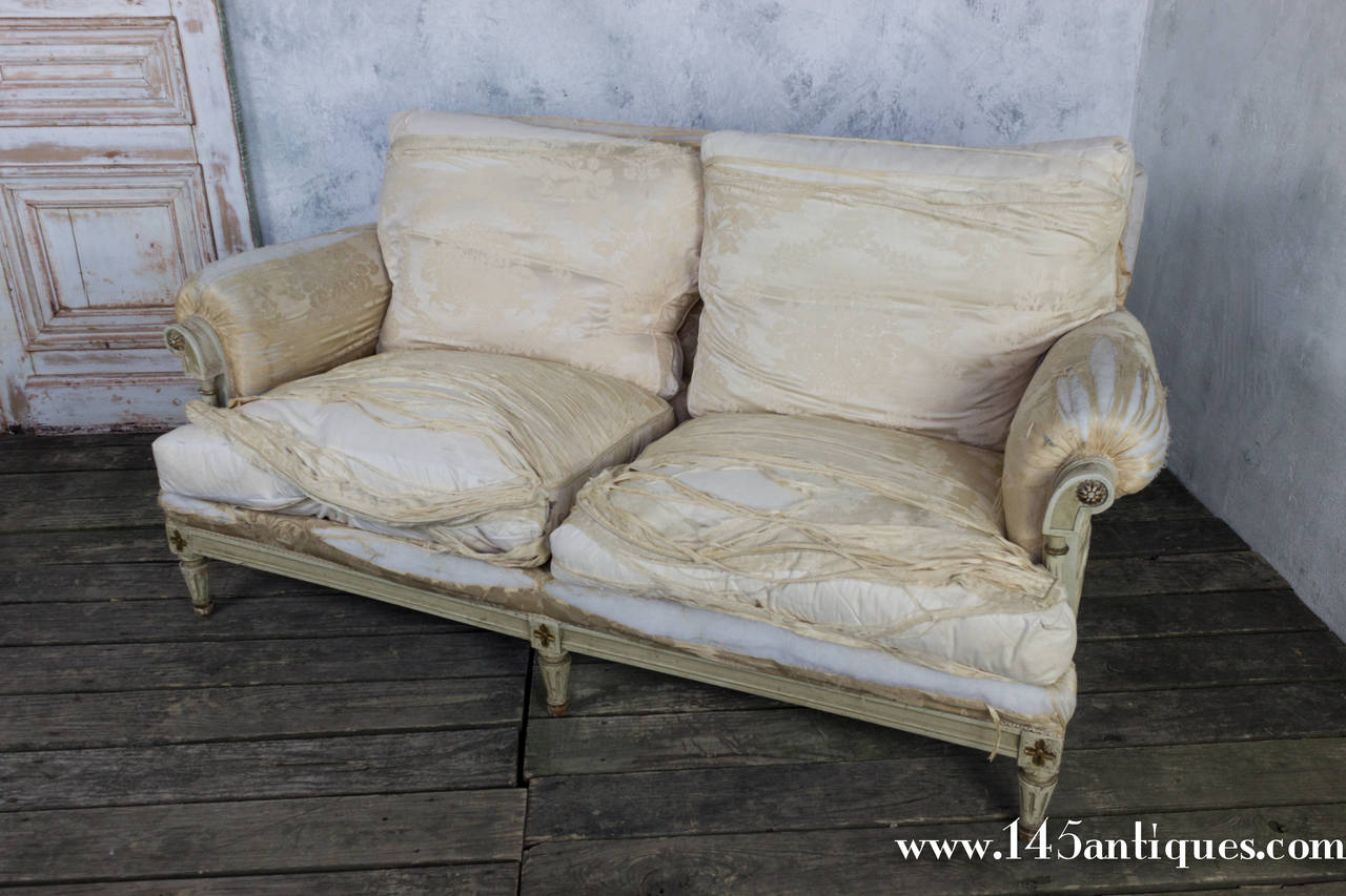 French settee, the fabric has seen better days. But it was a beautiful gold, silk fabric, the perfect match to the gold and off white patinated  frame. French around 1920s.

Sold AS IS. 

Upholstery and Refinishing options are available