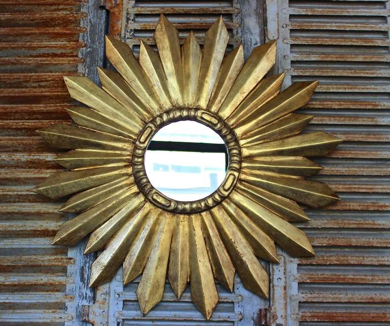 Beautiful over sized sunburst mirror, French circa 1980.  Hand gilt with a nice patina.