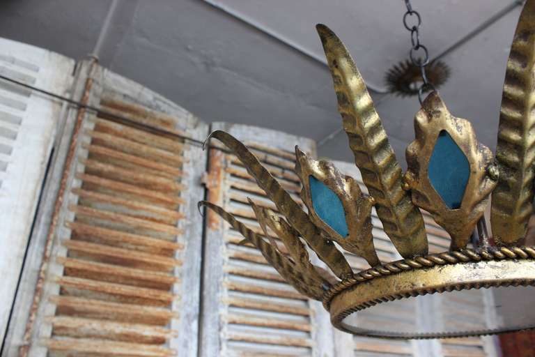 Spanish 1940's gilt metal acanthus leaf ceiling fixture with peacock blue glass diamonds and frosted glass.  Newly wired with candelabra sockets for showroom display.