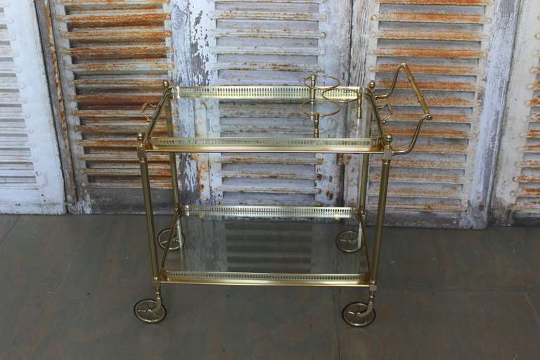 French 1960’s Brass  Rectangular Bar Cart with removable serving tray and lower glass shelf.