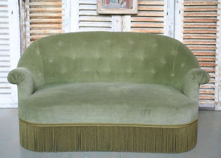 Small-scale settee, French 19th century, Napoleon III style. Very comfortable and in very good condition. Upholstered in a sage green velvet with contrasting bullion fringe.
      
     
