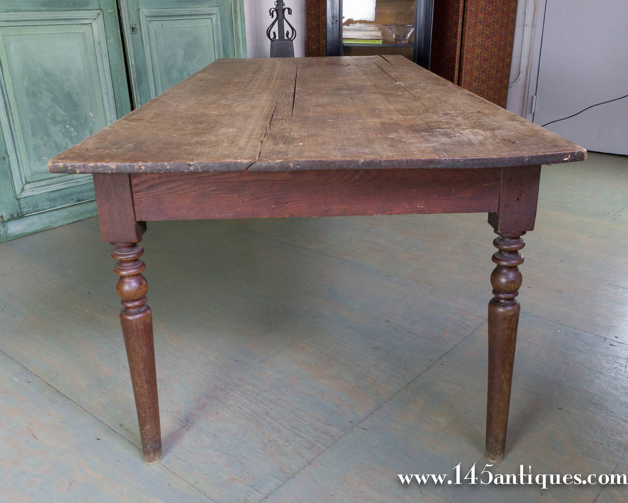 Vintage large oak farm table with turned legs.