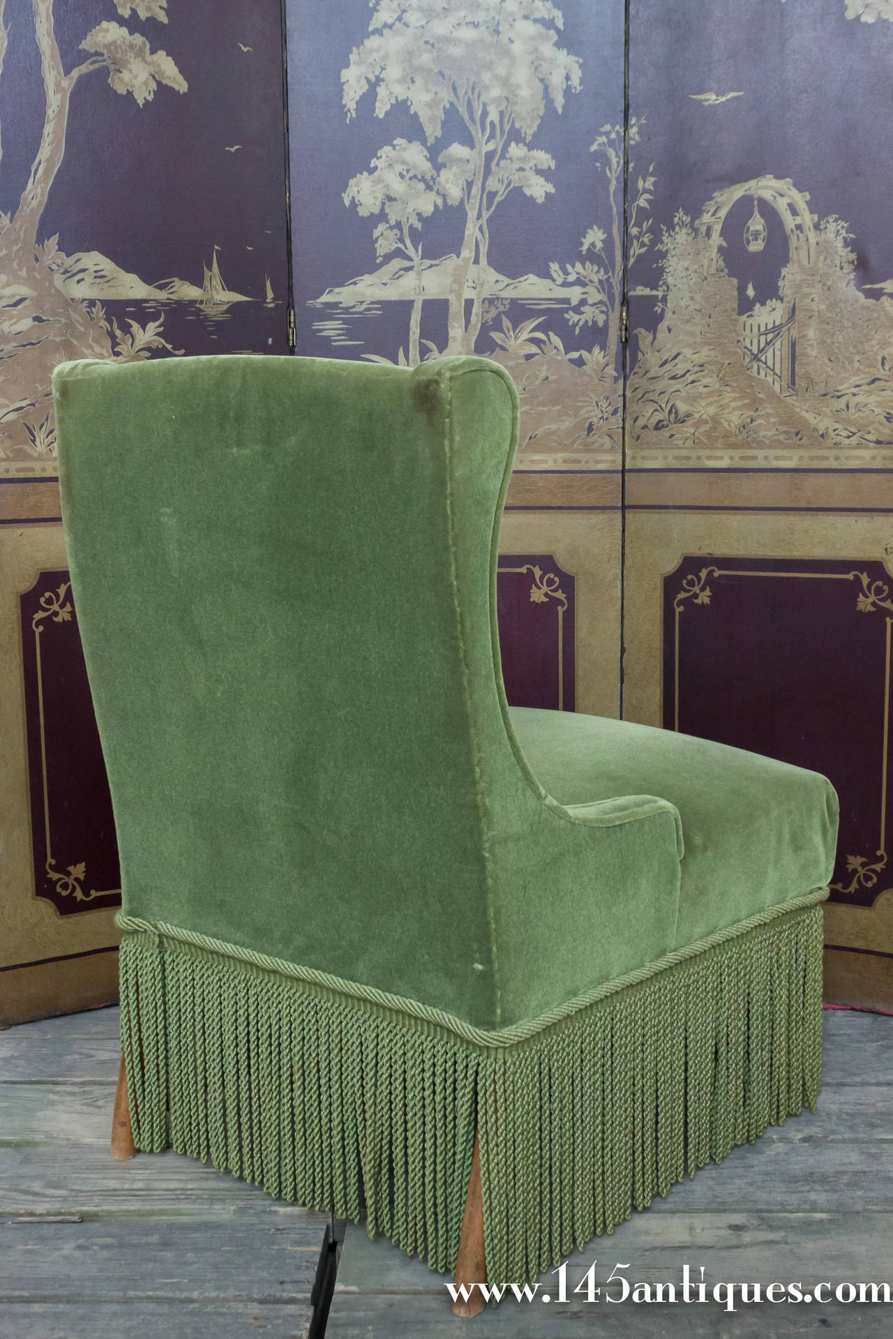 Set of four Napoleon III slipper chairs in green velvet with bouillon fringe.  There is also a matching sofa (SN0215-14).  These chairs are sold AS IS