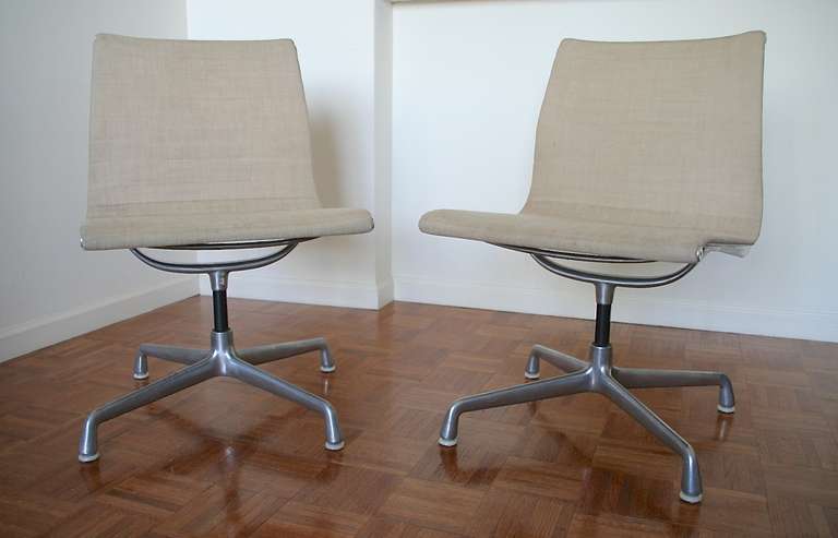 Pair of eames aluminium Swivel chairs.