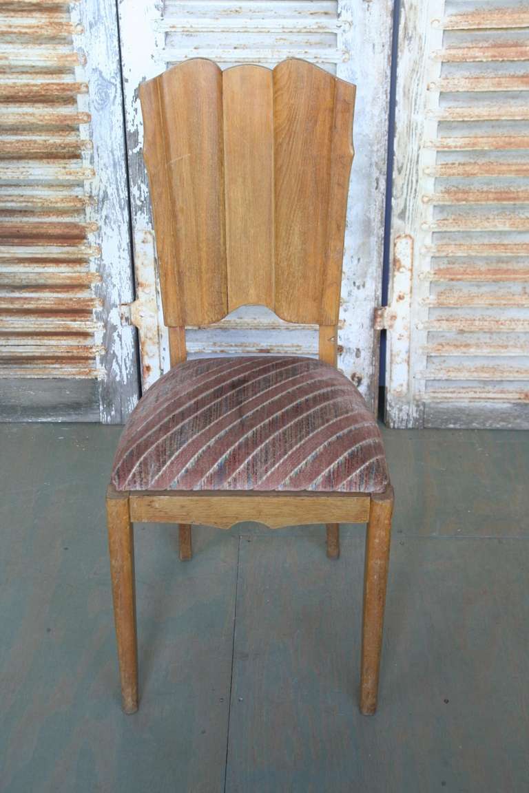 This is a set of six French oak side chairs with carved 