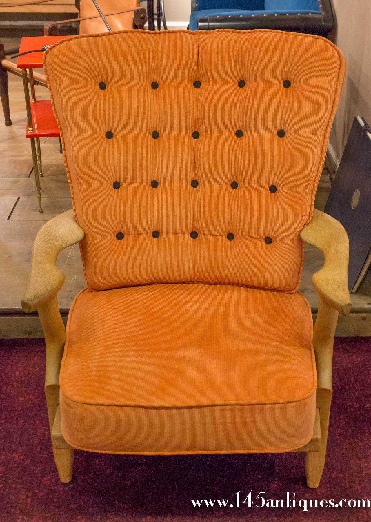 Very nice pair of oak armchairs recently reupholstered in orange corduroy fabric with contrasting dark brown buttons. 

Item located in France, please allow 5 to 10 weeks delivery to New York City. Price includes regular shipping to New York.