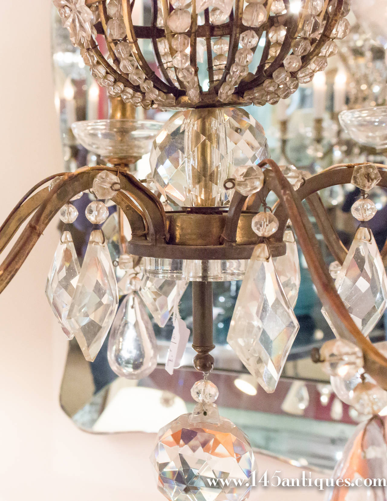 Unusual Bagues chandelier in bronze and crystal, French, 1940s.

Item located in France, please allow 4 to 6 weeks delivery to New York City. Price includes regular shipping to New York. Expedited shipping available upon request.
