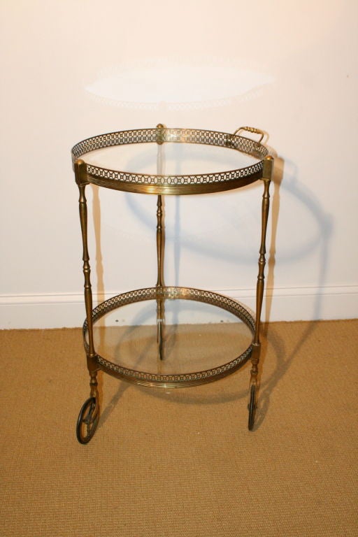 French 1940's brass tea cart with two glass shelves.