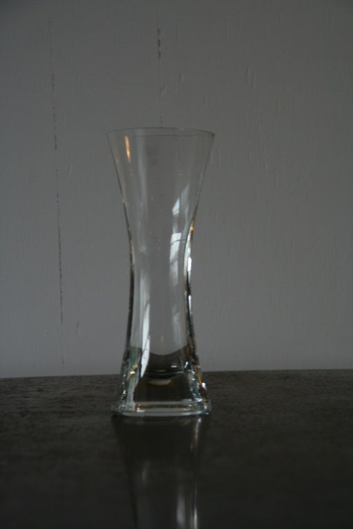 Lovely curved mid century clear glass vase from France.

Ref #: H1112-08

Dimensions: 9.25