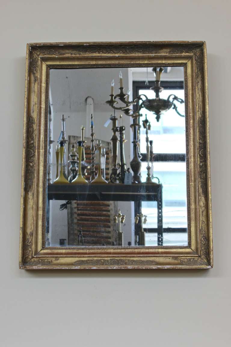 French 19th century Neoclassical style mirror with an elaborate gilt frame and original mercury mirror. Fair condition.

Ref #: DM0612-01

Dimensions: 31.5