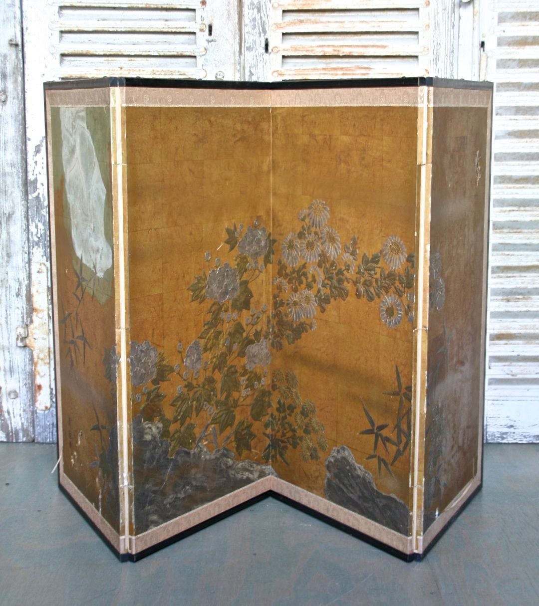 Interesting folding screen with a hand-painted floral scene on the front and contrasting geometric patterned backside. Handmade in Kyoto, Japan. This item is available for rental only. Each panel measures 18.5