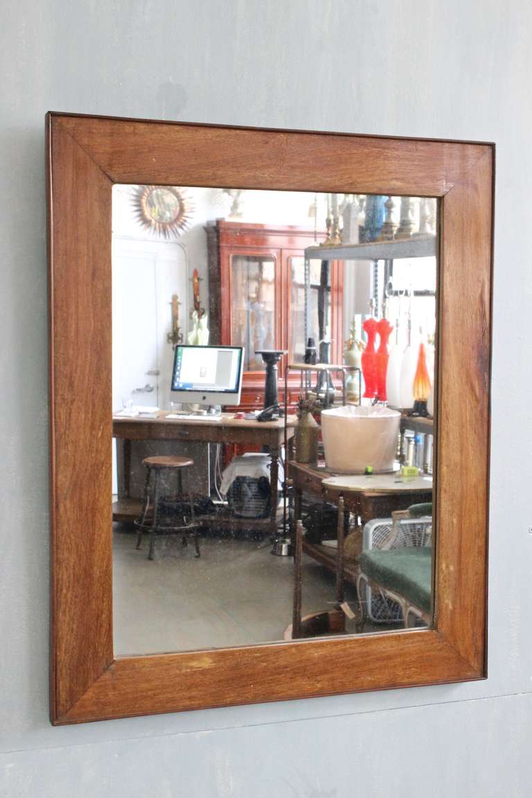 French 19th century mirror with mahogany frame and original glass.